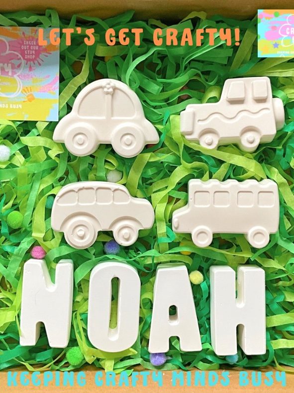 Four plaster of Paris vehicles, on Green shredded tissue paper. Six paints in yellow, blue, green, red, teal, orange. Name spelling Noah. 