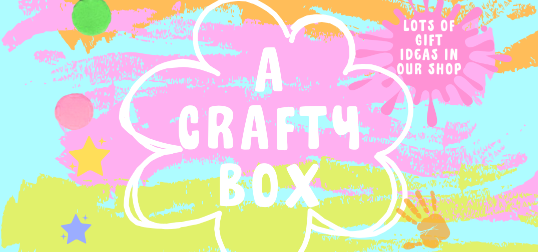 A Crafty box logo in pink orange and blue. Pink paint splattered on logo and a paint imprint of a hand. 