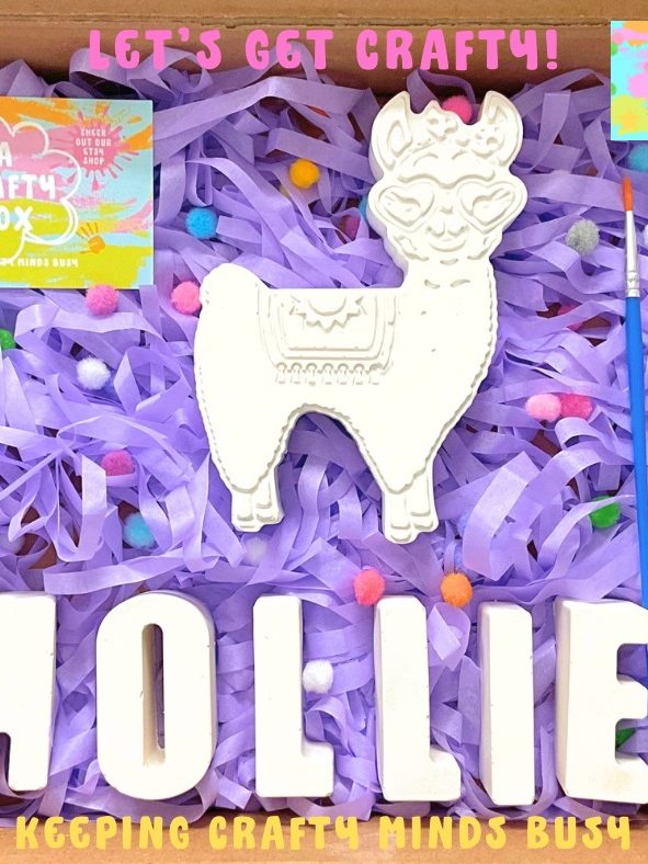 Kids craft box. Purple tissue paper underneath a large alpaca mould. Six pastel paints and plaster of Paris name spelling Mollie. 