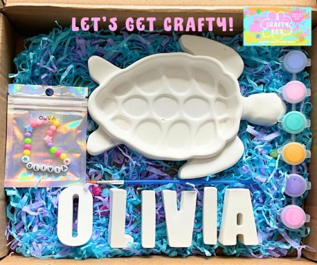 Large turtle jewelry dish. Six paints and a paintbrush. Make your own bracelet in a see-through gift bag.